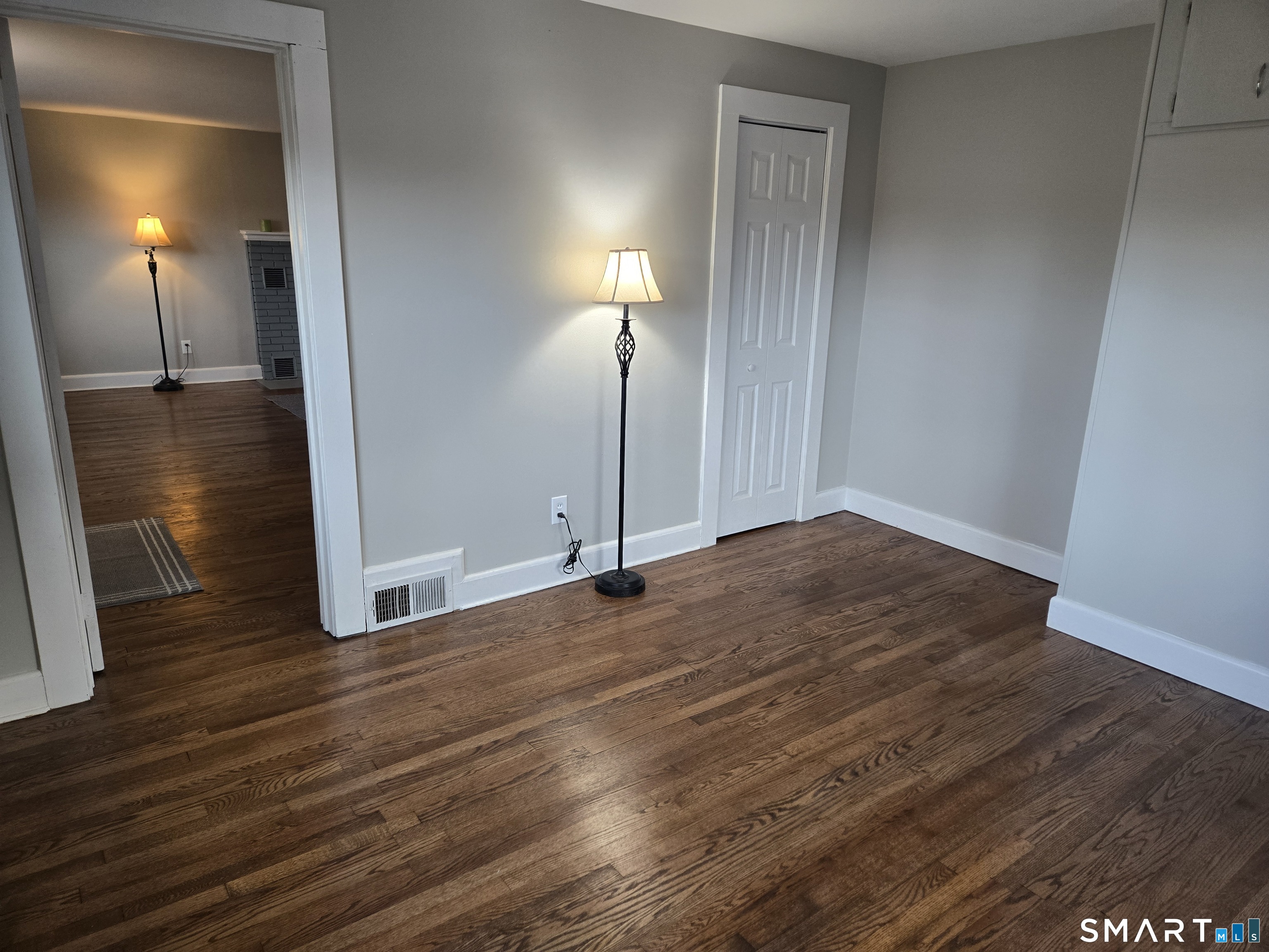 242 Elm Street Enfield, CT 06082 - Photo 11 of 21 a view of empty room with wooden floor