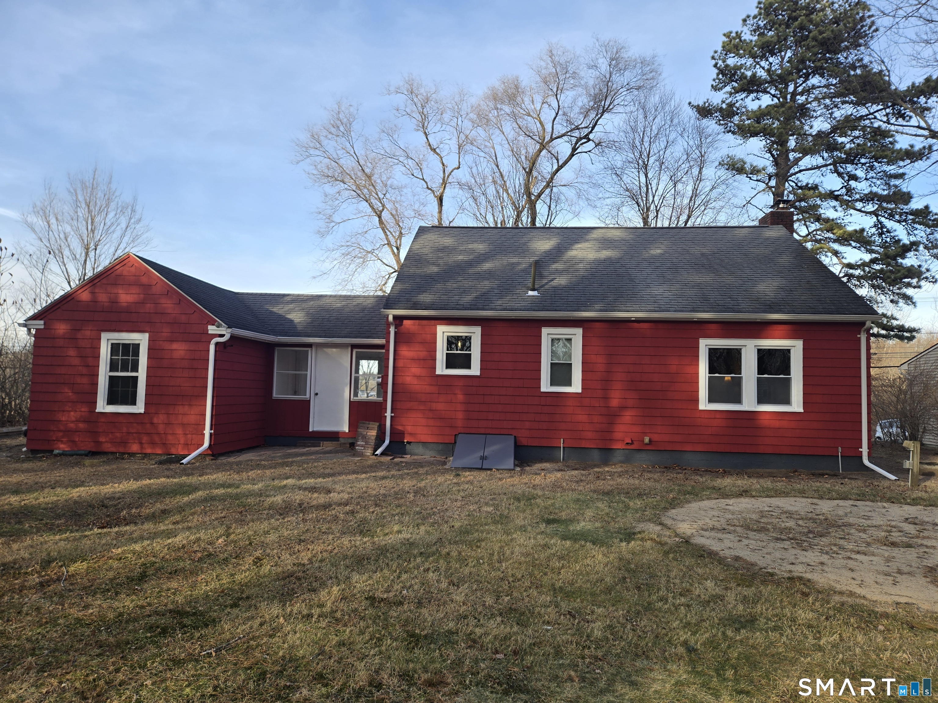242 Elm Street Enfield, CT 06082 - Photo 2 of 21 a front view of a house with a yard