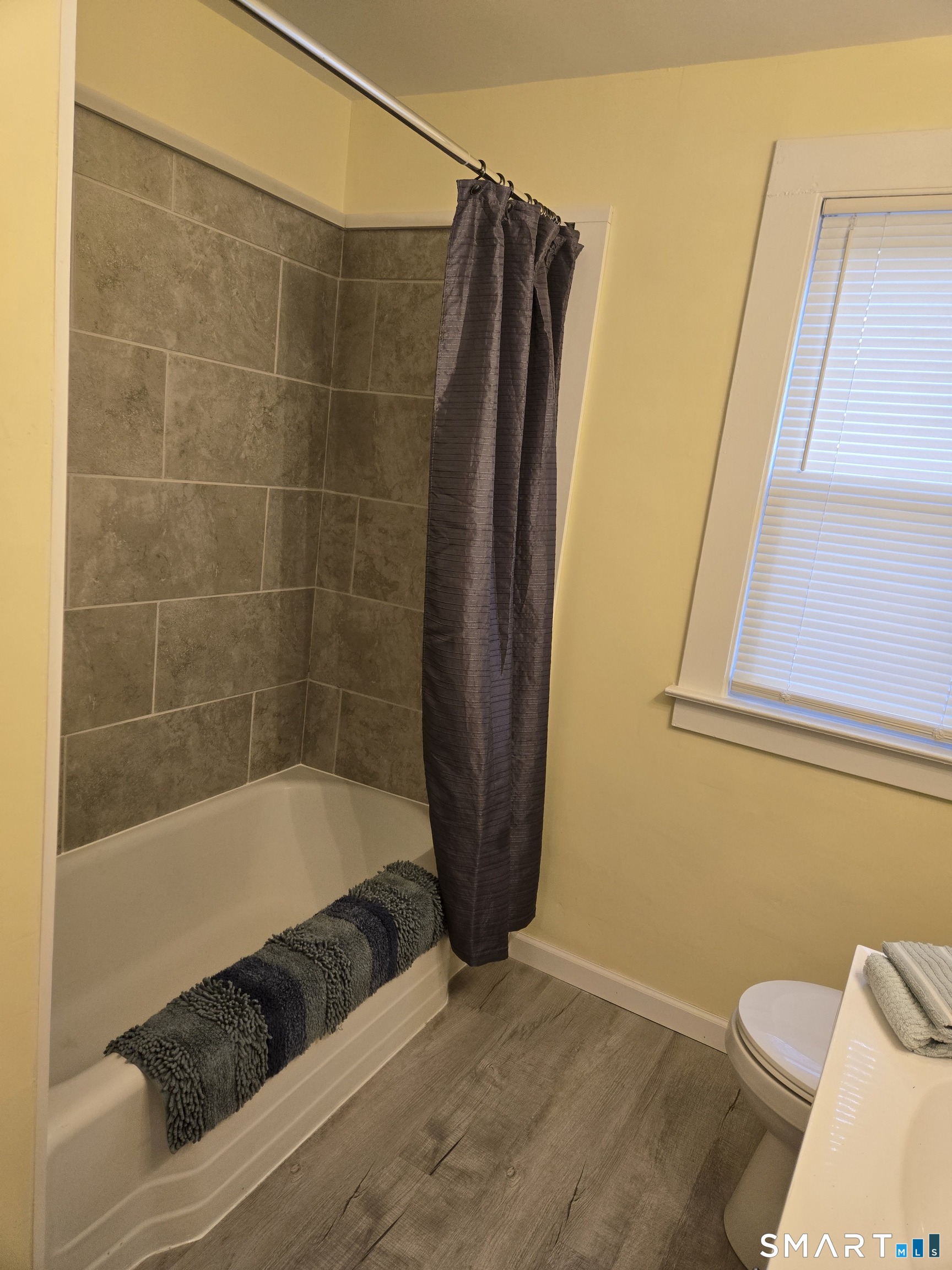 242 Elm Street Enfield, CT 06082 - Photo 7 of 21 a bathroom with a bathtub and a shower