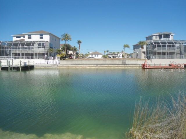 3464 Bluefish Drive Hernando Beach, FL 34607 - Photo 3 of 4 a view of building with lake view