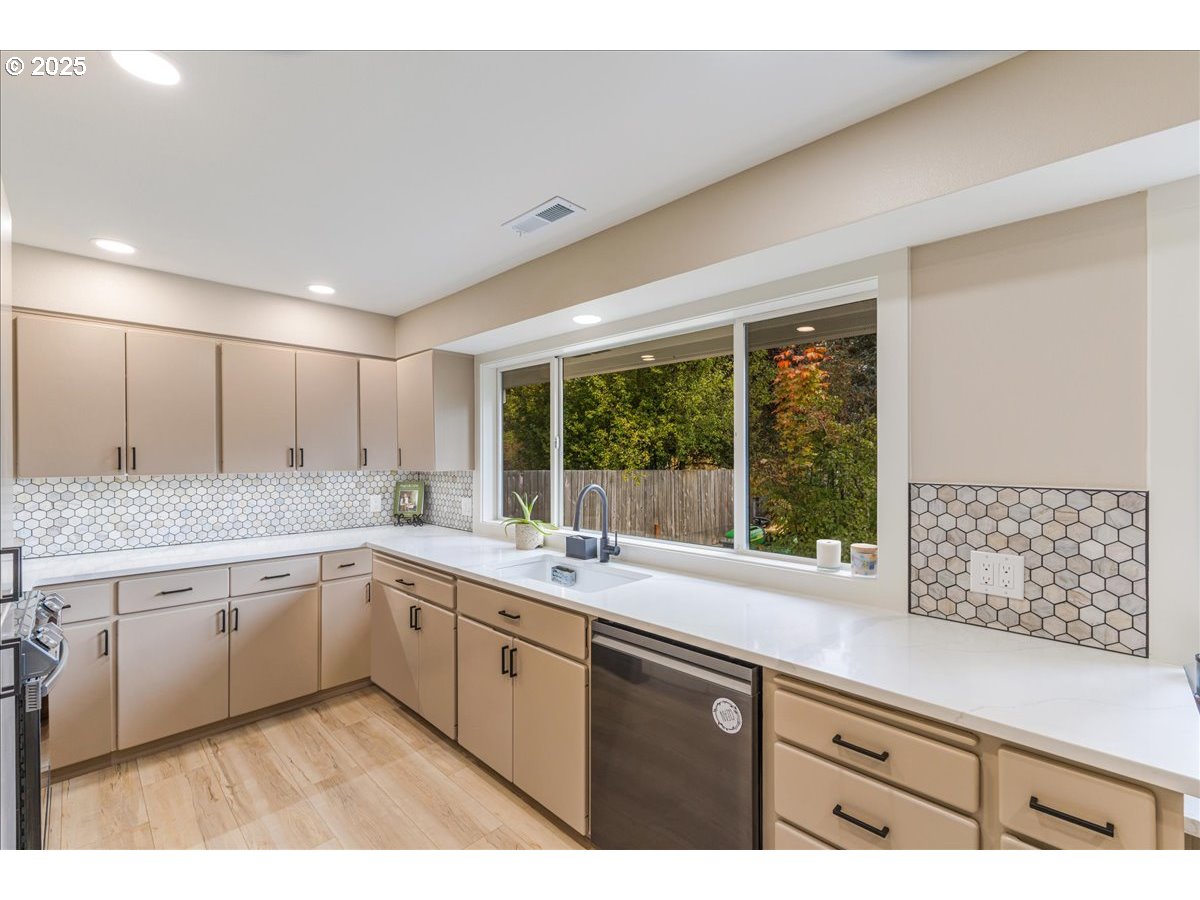 1317 Filbert Street Forest Grove, OR 97116 - Photo 13 of 29 a kitchen with a sink stove and cabinets