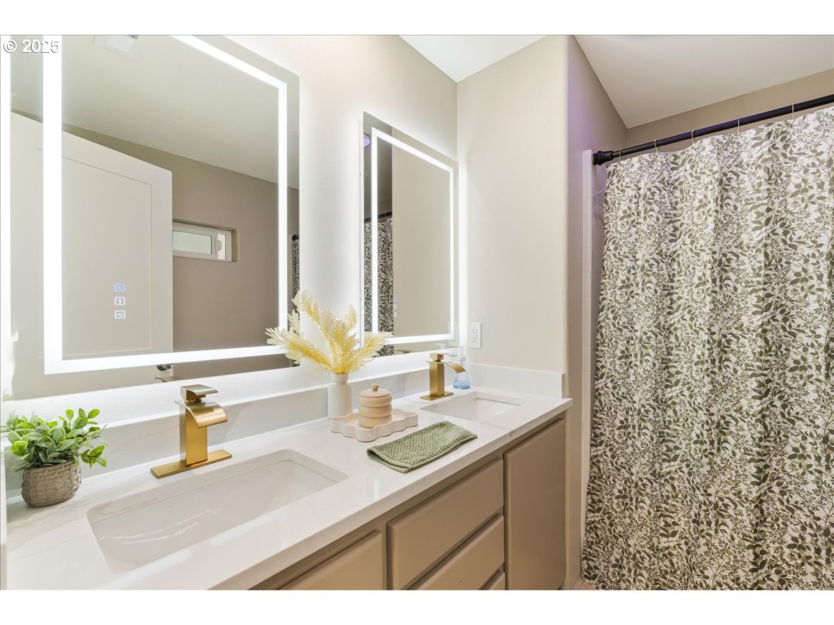 1317 Filbert Street Forest Grove, OR 97116 - Photo 19 of 29 a bathroom with a sink mirror and a shower