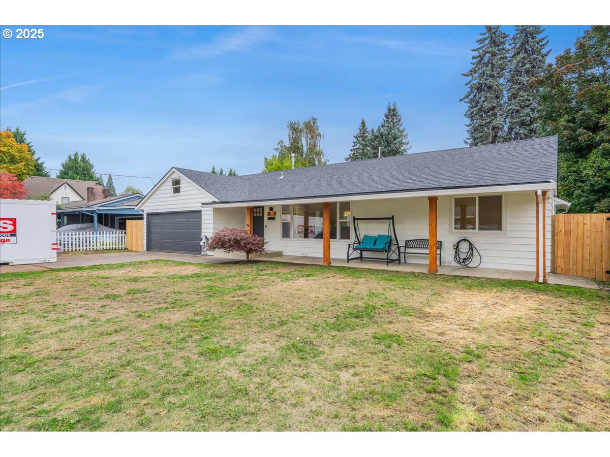 1317 Filbert Street Forest Grove, OR 97116 - Photo 2 of 29 a front view of a house with a garden