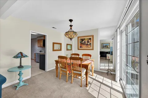 a living room with furniture fireplace and a window