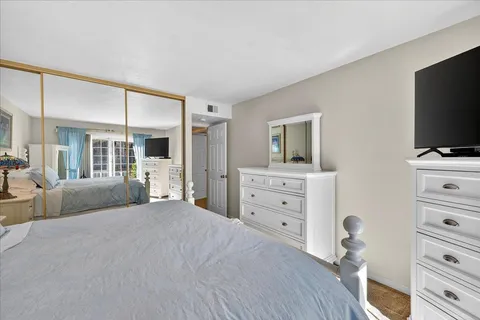 a bathroom with a shower sink and mirror