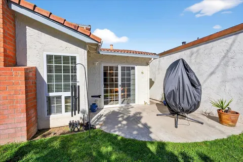 a view of multiple houses with cars parked