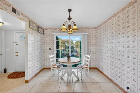 a kitchen with stainless steel appliances granite countertop a refrigerator sink stove microwave and cabinets