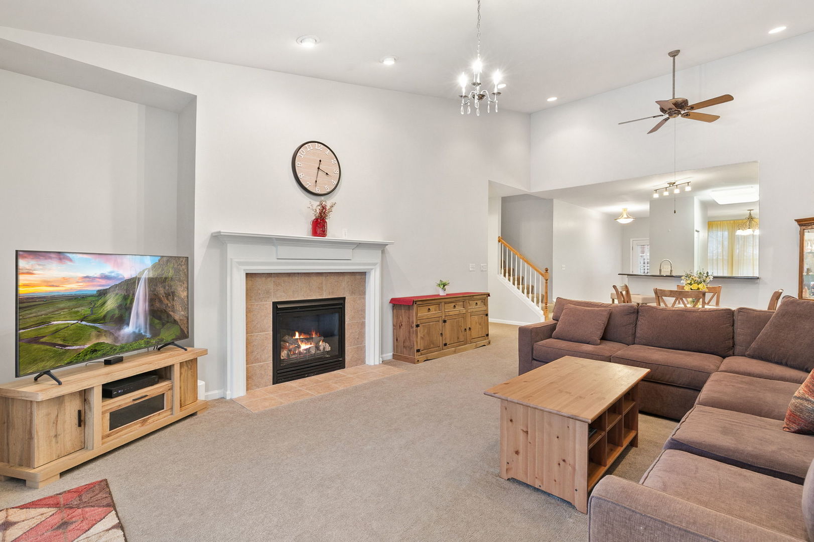 2854 Waterfront Avenue Algonquin, IL 60102 - Photo 3 of 29 a living room with furniture a fireplace and a flat screen tv