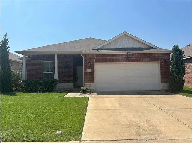 a front view of a house with yard