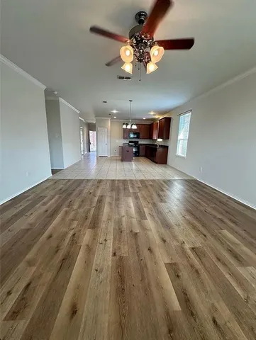a view of living room with furniture and a chandelier