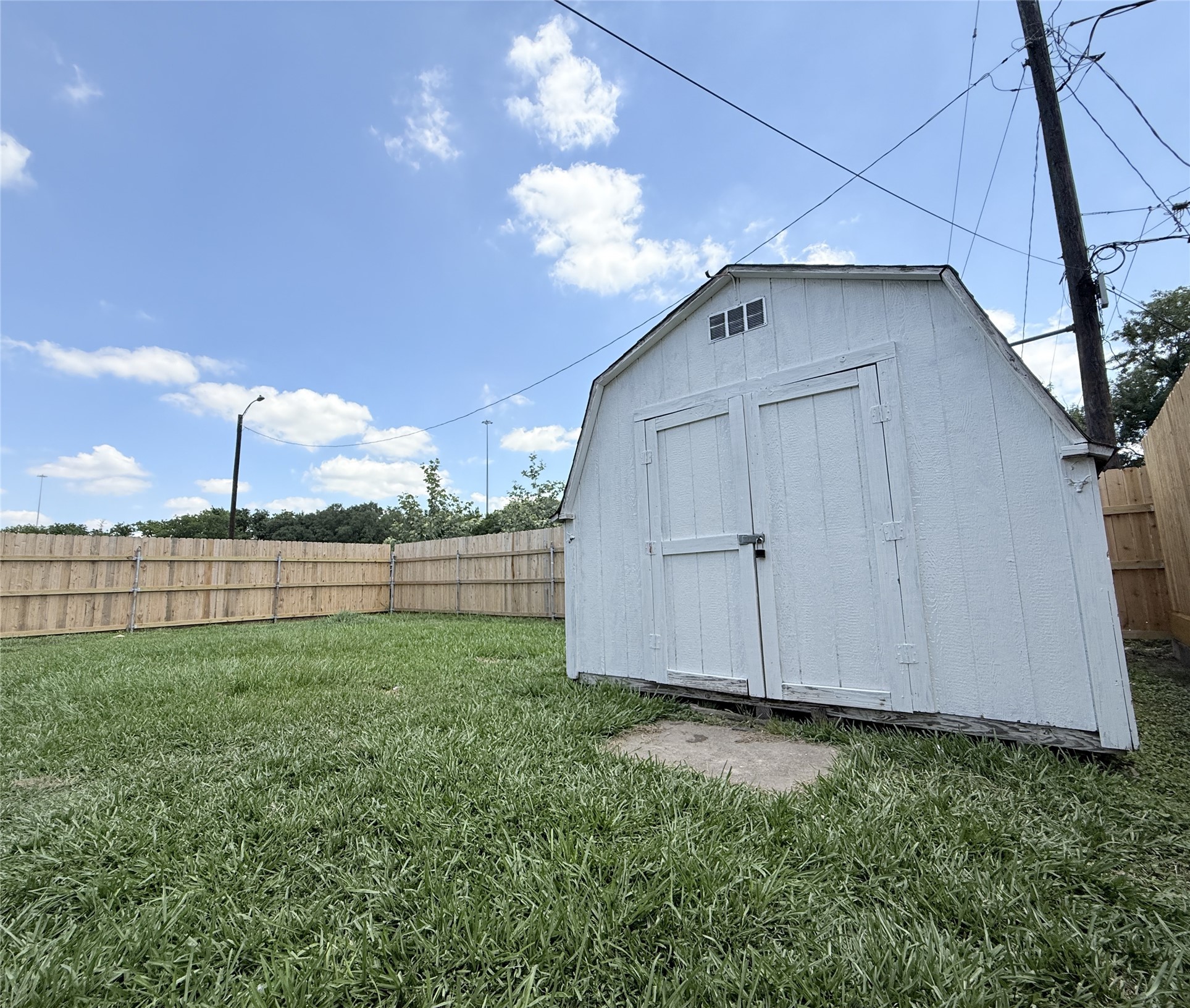 1922 Tabor Street Houston, TX 77009 - Photo 18 of 24 Beyond the storage shed is a large back yard.