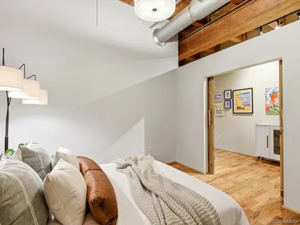 a bedroom with bed and a walk in closet