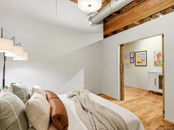 a bedroom with bed and a walk in closet