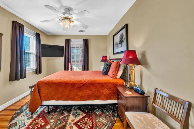 a view of a backyard with table and chairs and potted plants