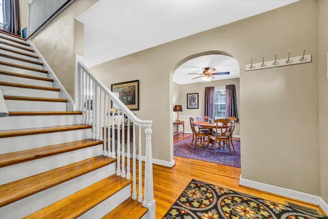 a living room with furniture fireplace and a window