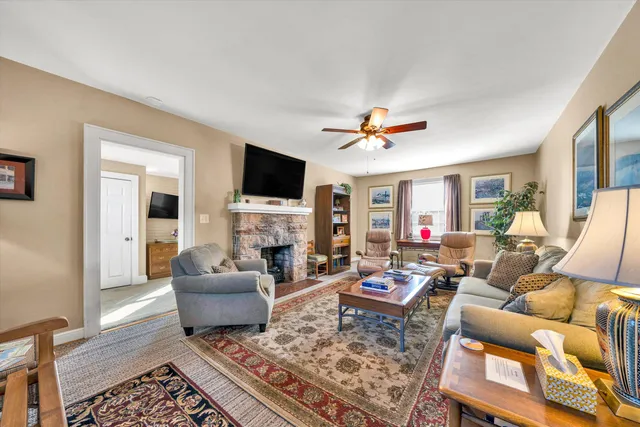 a kitchen with stainless steel appliances kitchen island granite countertop a sink and a microwave