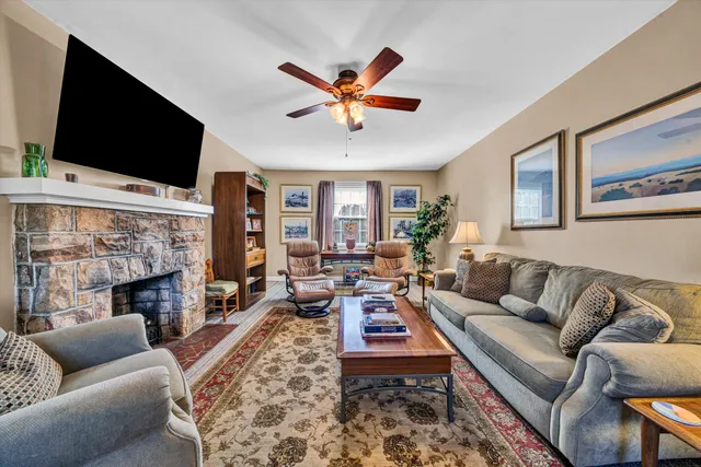 a dining room with a wooden table and chairs