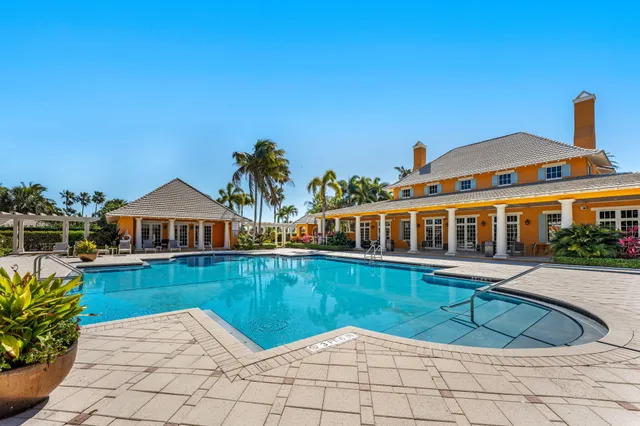 a front view of a house with a yard table and chairs