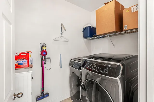 a front view of a house with a garden and yard