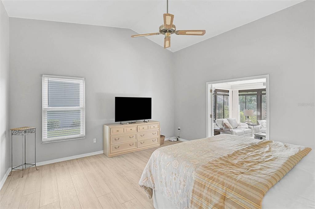 4312 Pro Am Avenue East Bradenton, FL 34203 - Photo 13 of 37 a bedroom with a bed and a flat screen tv