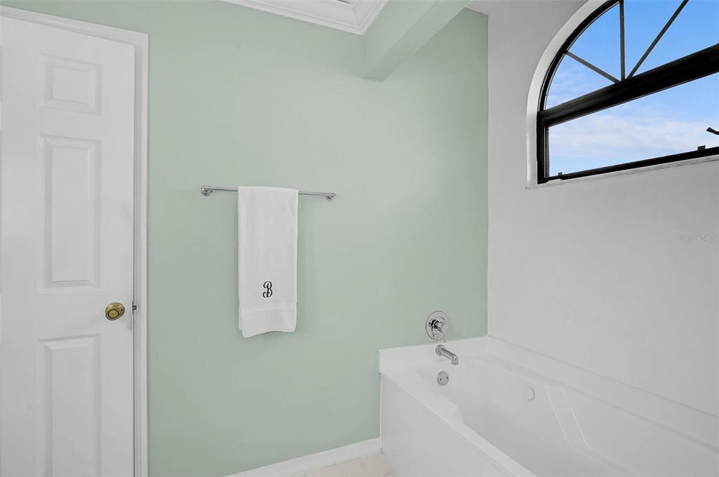 4312 Pro Am Avenue East Bradenton, FL 34203 - Photo 16 of 37 a bathroom with a bathtub and shower