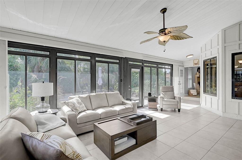 4312 Pro Am Avenue East Bradenton, FL 34203 - Photo 32 of 37 a living room with furniture and floor to ceiling windows