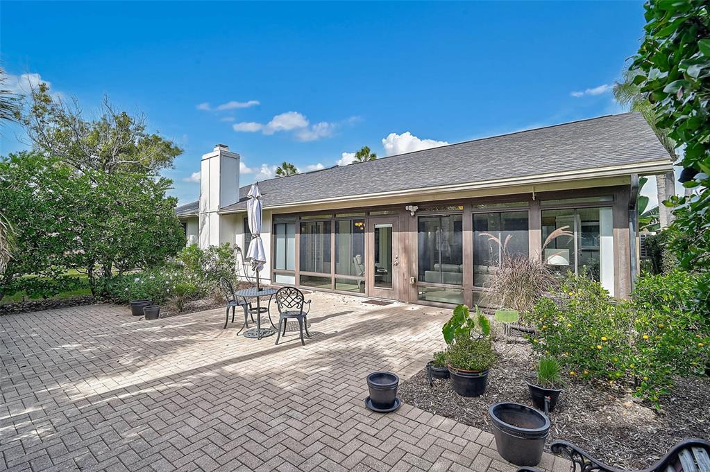 4312 Pro Am Avenue East Bradenton, FL 34203 - Photo 33 of 37 a front view of a house with a patio