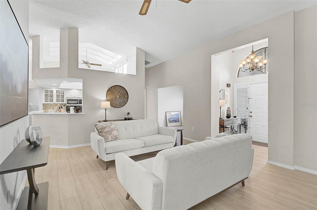 4312 Pro Am Avenue East Bradenton, FL 34203 - Photo 7 of 37 a living room with furniture and a large window