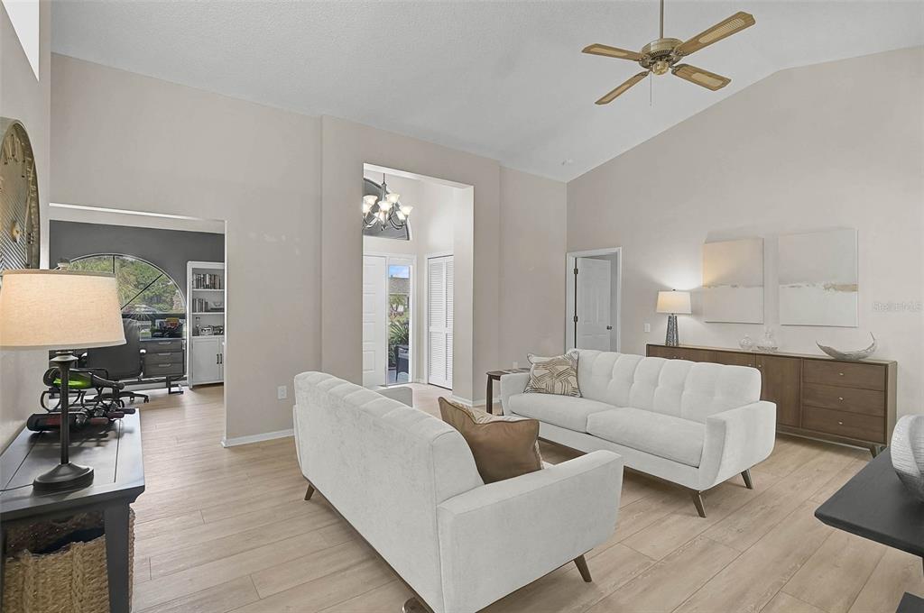 4312 Pro Am Avenue East Bradenton, FL 34203 - Photo 8 of 37 a living room with furniture and a wooden floor