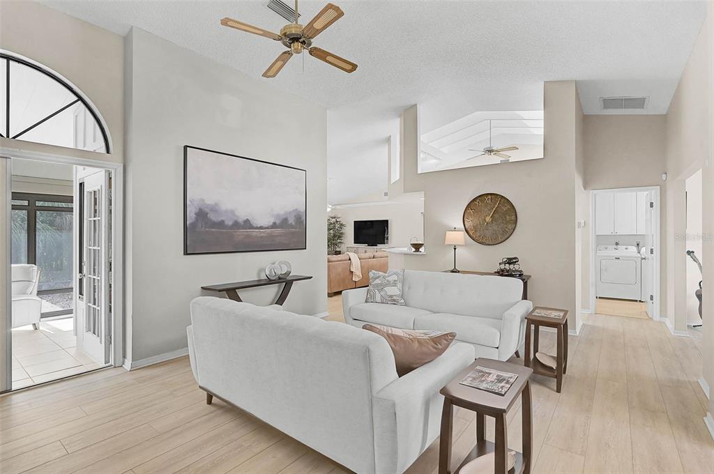 4312 Pro Am Avenue East Bradenton, FL 34203 - Photo 10 of 37 a living room with furniture and a wooden floor