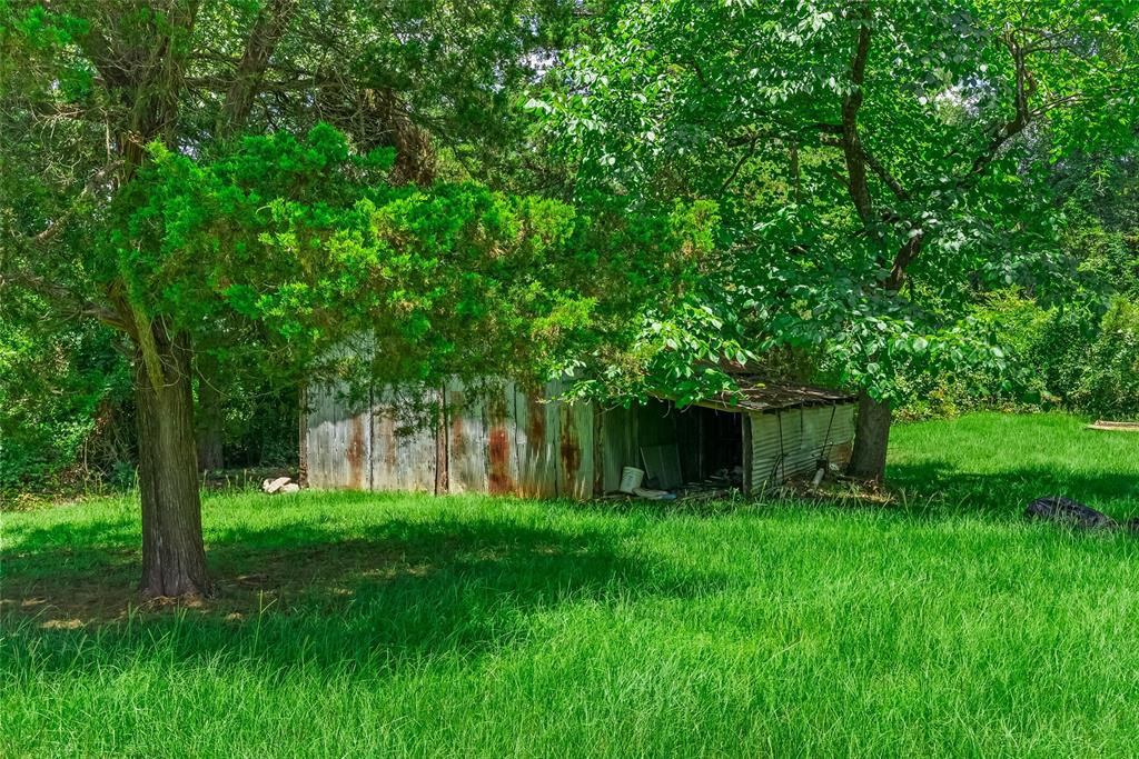 9008 Hosston Vivian Road Vivian, LA 71082 - Photo 27 of 30 a view of front of a house with a big yard