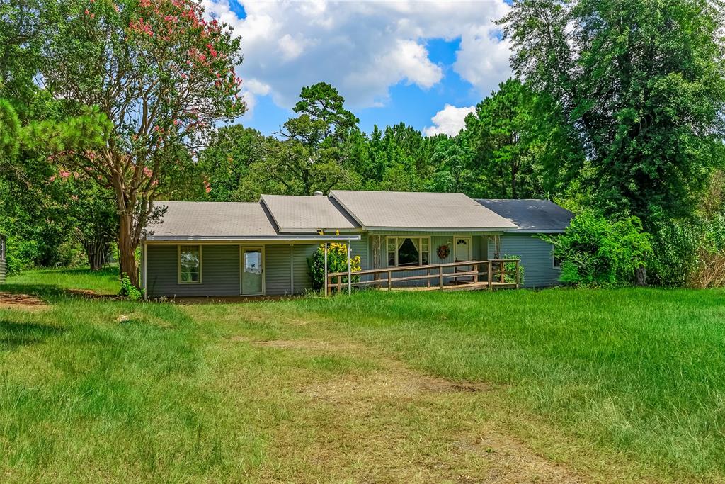 9008 Hosston Vivian Road Vivian, LA 71082 - Photo 30 of 30 a aerial view of a house with swimming pool garden view and trees