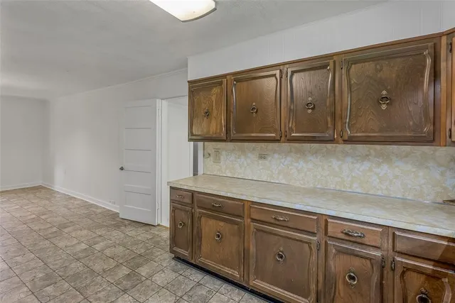 a kitchen with stainless steel appliances granite countertop a sink and cabinets