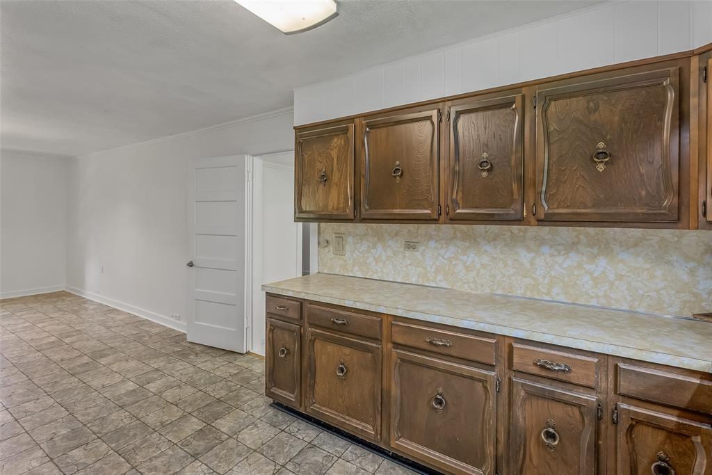 9008 Hosston Vivian Road Vivian, LA 71082 - Photo 10 of 30 a kitchen with stainless steel appliances granite countertop a sink and cabinets