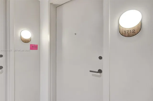 a bedroom with a bed and cupboard