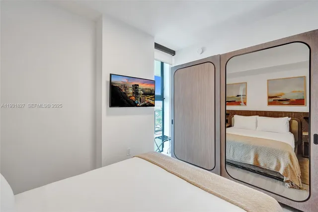a view of storage and utility room with washer and dryer