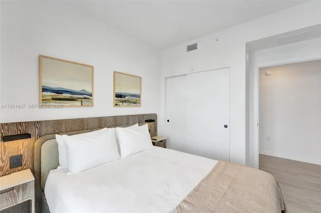 a view of a patio with couches table and chairs and potted plants