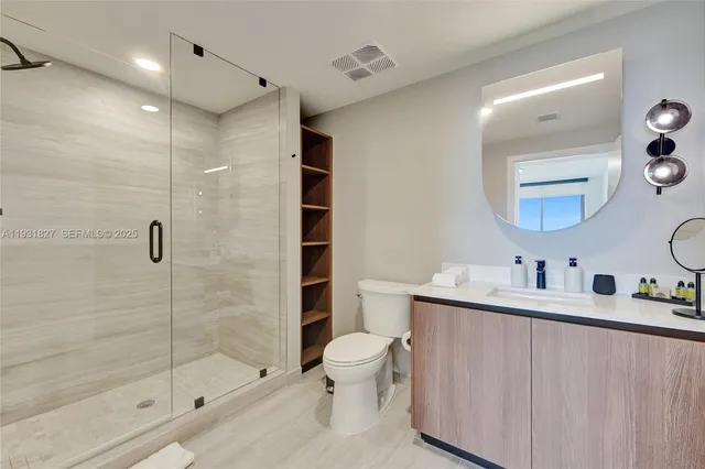 a view of a swimming pool with a table and chairs under an umbrella