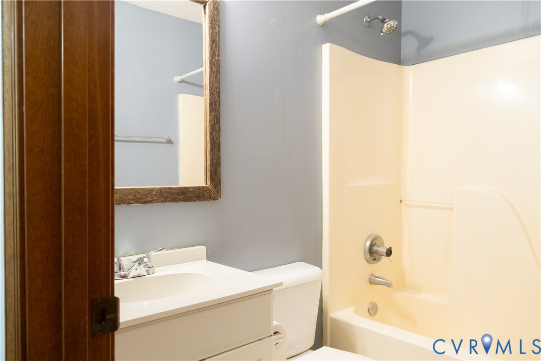 2477 Calno Road Hanover, VA 23069 - Photo 22 of 33 a bathroom with a sink a toilet and shower