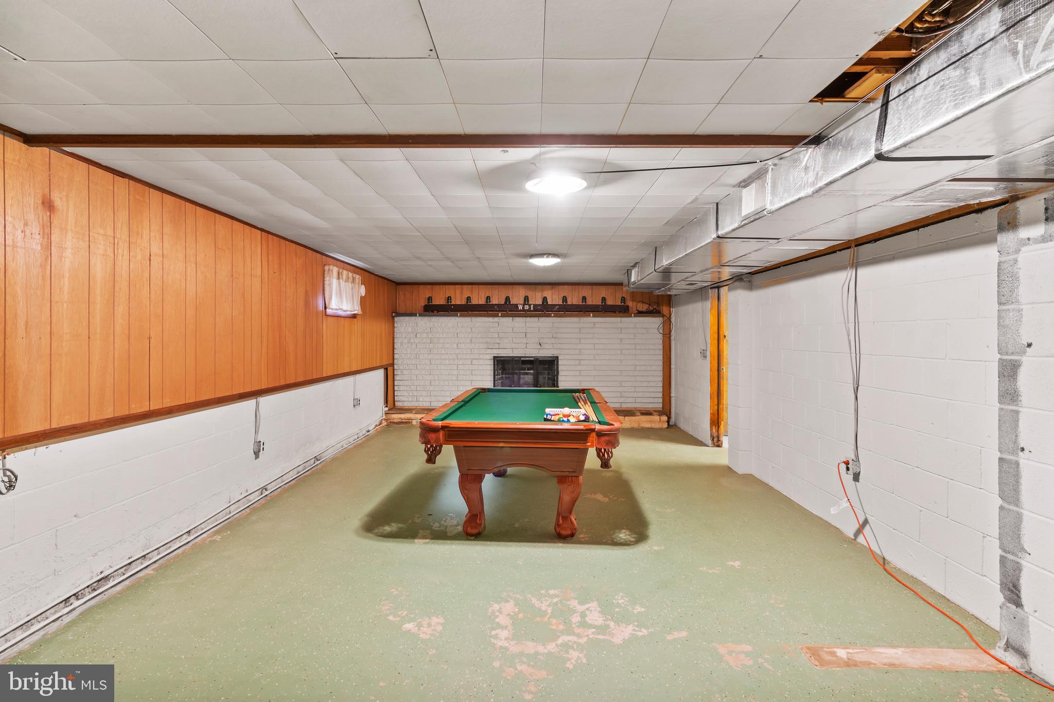 10002 Upper Strasburg Road Upperstrasburg, PA 17265 - Photo 31 of 31 Basement Game Room with Fireplace