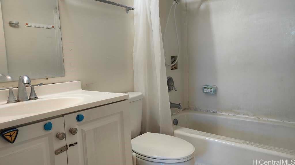 1325 North School Street, Unit C323 Honolulu, HI 96817 - Photo 9 of 11 a bathroom with a sink a toilet and shower