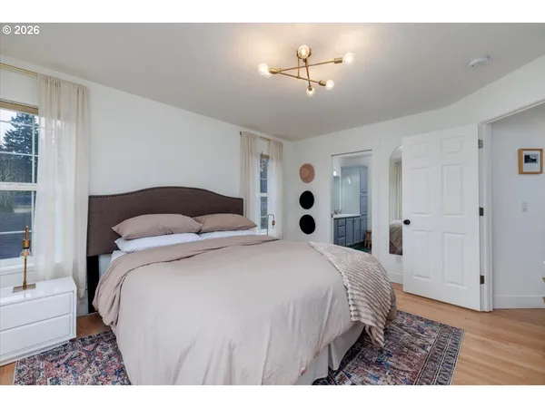 a bedroom with a bed and a view of bathroom