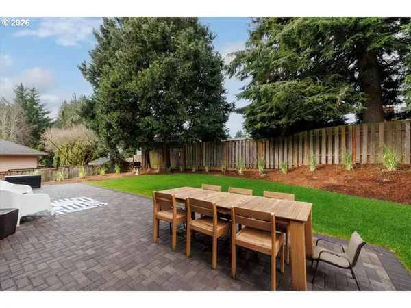a view of a table and chairs in the garden