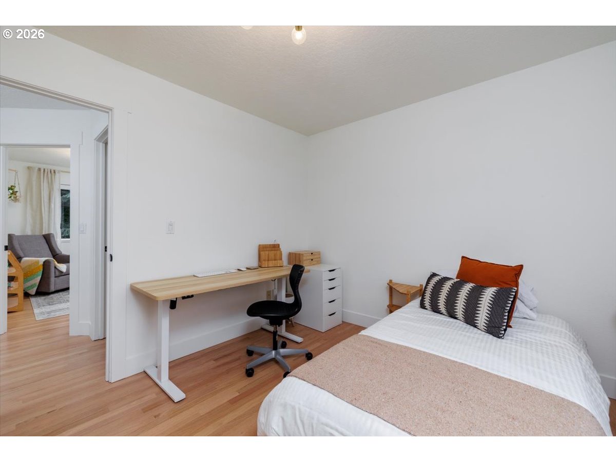 36745 Eldridge Drive Sandy, OR 97055 - Photo 21 of 39 a bed room with a bed and a chair