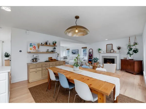 a kitchen with a dining table and chairs