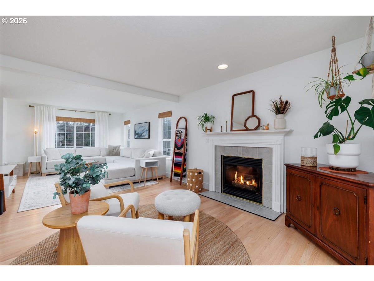 36745 Eldridge Drive Sandy, OR 97055 - Photo 3 of 39 a living room with furniture a fireplace and a potted plant