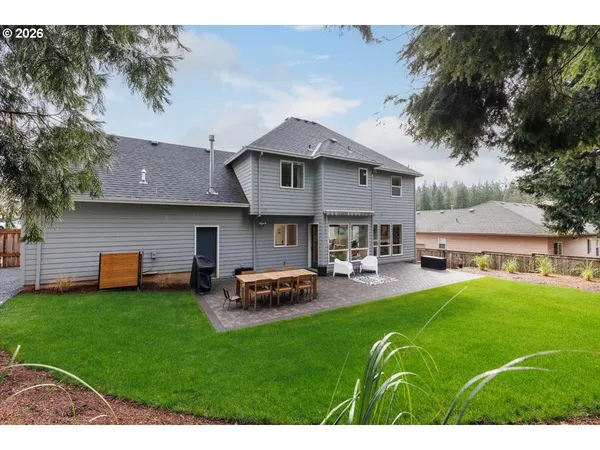 a front view of house with yard and outdoor seating