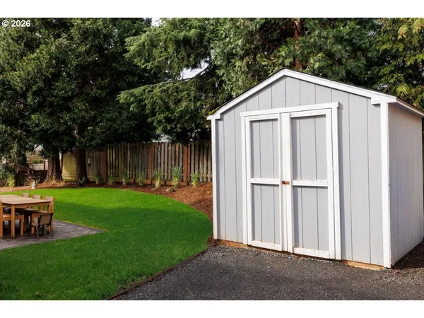a view of a dinning table and chairs in the patio