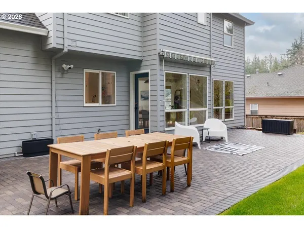 a view of a house with sitting area and garden