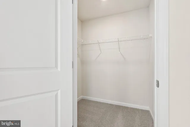 a view of a hallway with staircase